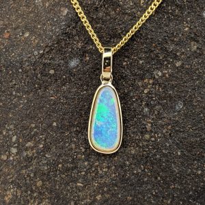Solid Crystal Opal 9K Yellow Gold Pendant
