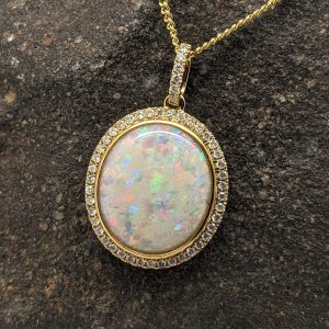 Solid White Opal 9K Yellow Gold Pendant With Diamond Halo Setting