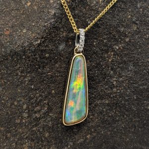 Solid White Crystal Opal 9K Yellow Gold Pendant With Diamonds