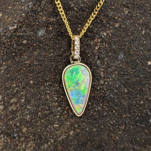 Solid White Crystal Opal 9K Yellow Gold Pendant With Diamond Bail